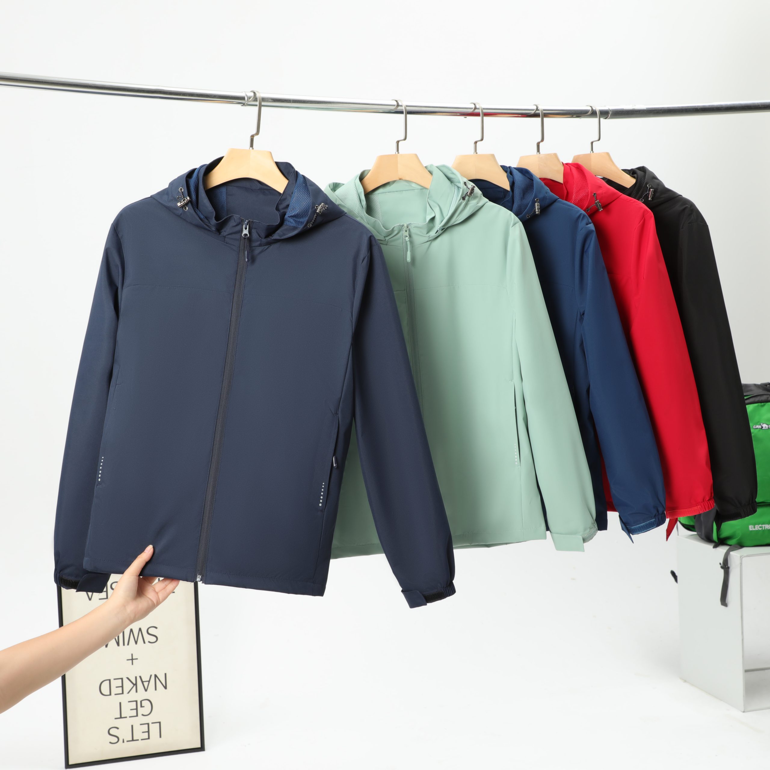 Premium custom jacket manufacturing, close up YKK metal hardware and anti-wind crisp fabric texture